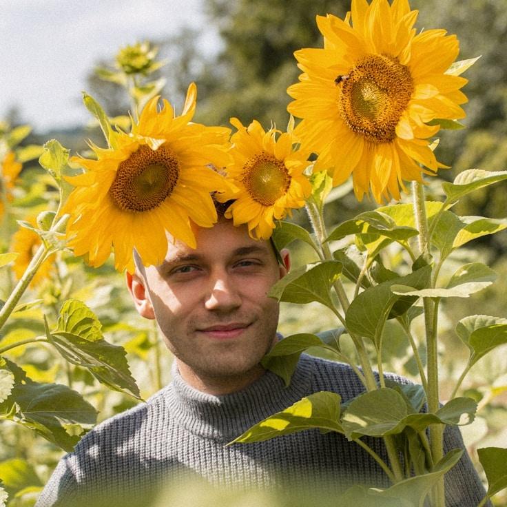 Alex Kim, Lead Design Curator at Quiet Mind Studio, reviewing corporate floral arrangements